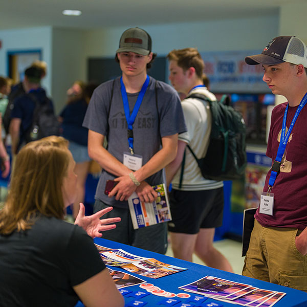 UNH staff talking to students