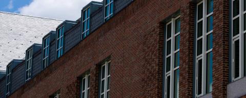 Exterior view of brick building with blue skies