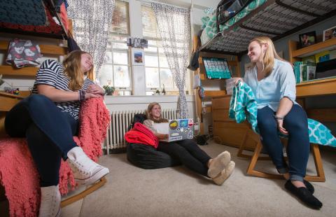 UNH students hanging out in residence hall room