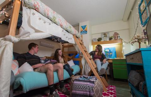 UNH students in residence hall room