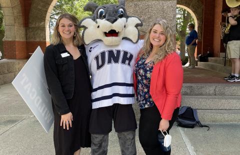 UNH student and staff with mascot 