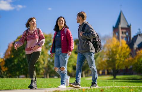 Brooke walking on campus with friends