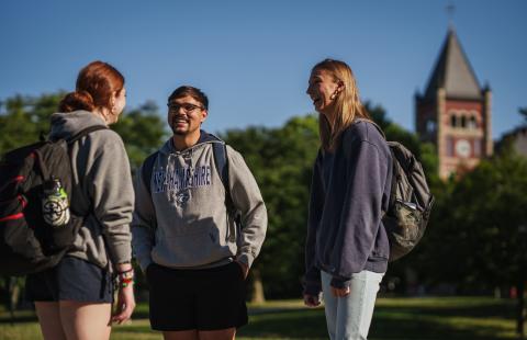 UNH students by Thompson Hall (T-Hall) on campus