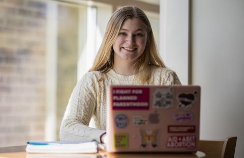 UNH student with laptop
