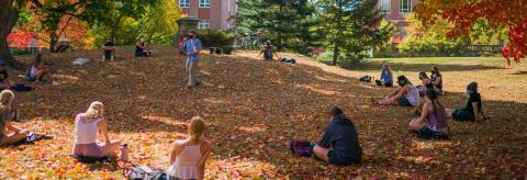 students attend outdoor class on UNH campus