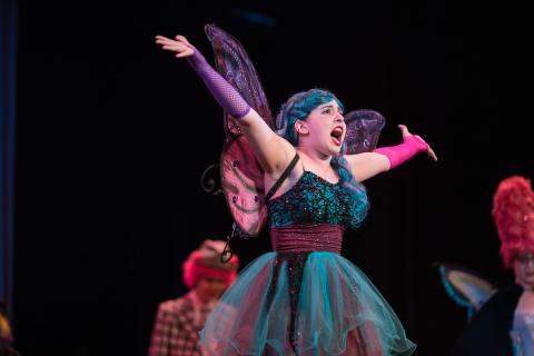 UNH student performing onstage
