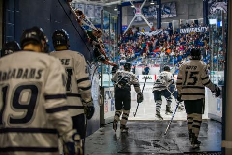 UNH hockey players prepare to enter Whittemore Arena