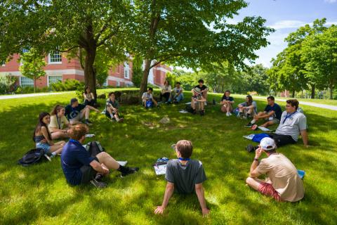 UNH students sitting in a circle during orientation 