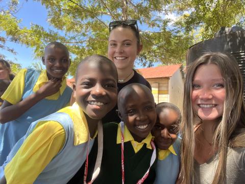 Grace and Alyssa with students in Kenya
