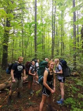 UNH students backpacking in the woods