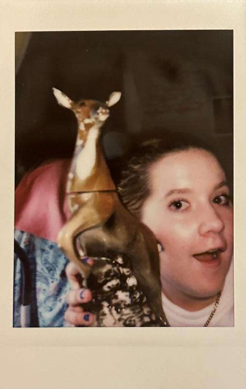 A polaroid my roommate took of me with the vintage deer I got in Arundel