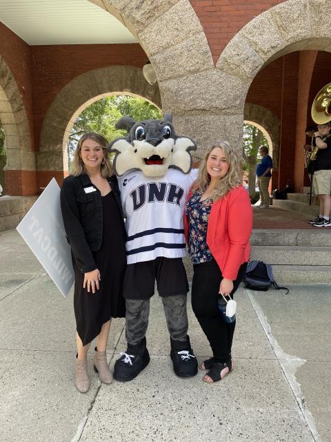 UNH student and staff with mascot 