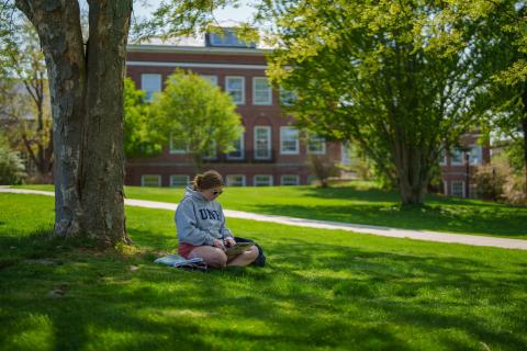 UNH student studying outside 