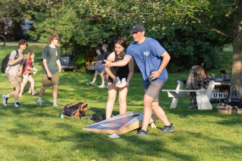 UNH students playing corn hole