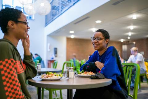 UNH students eating in Holloway Commons dining hall