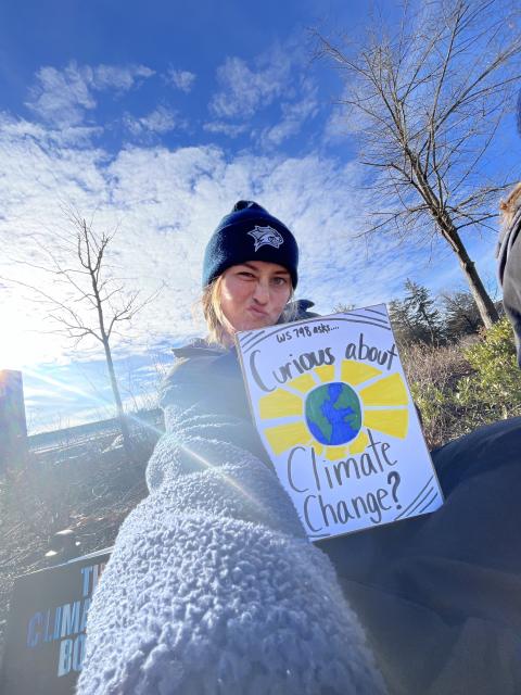 Selfie of me from an event called Climate Conversations that I was a part of for my climate activism capstone class (women's and gender studies major).