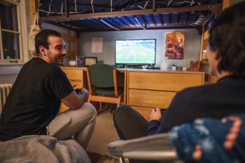 UNH students hanging out in residence hall room