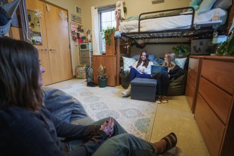 UNH students hanging out in residence hall room