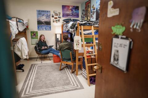 UNH students hanging out in residence hall room