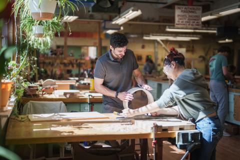 UNH students doing woodworking