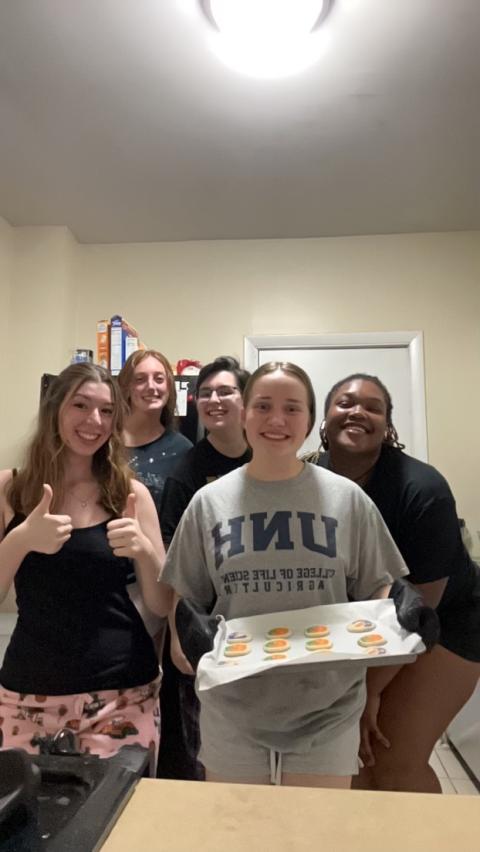 Sophia and Semester in the City cohort baking Pillsbury pumpkin cookies. 