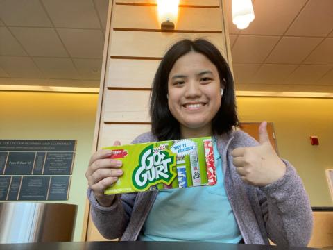 UNH student with yogurts