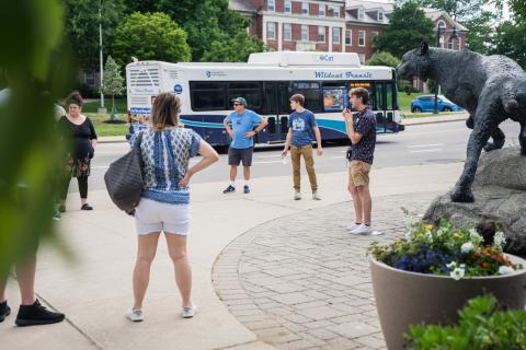 UNH student leading campus tour