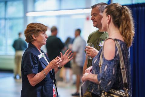 UNH parents talking to Dean of College of Liberal Arts, Michele Dillon