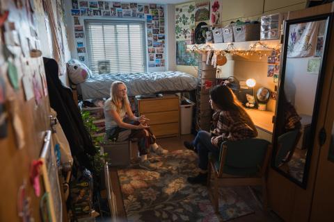 UNH students hanging out in residence hall room
