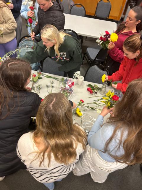 student making bouquets