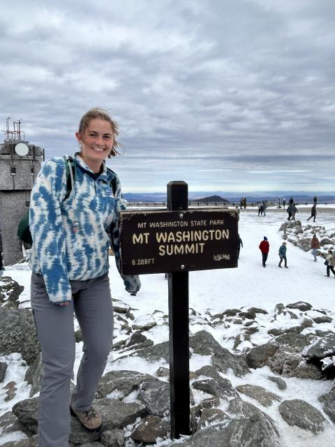 Posing at the summit of Mount Washington after hiking it in 2024.