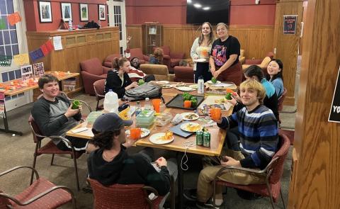 UNH students sitting at table