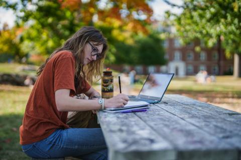 UNH student studying outside