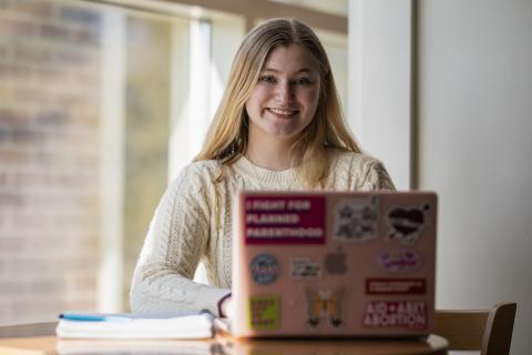 UNH student with laptop