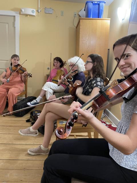 fiddle players playing together