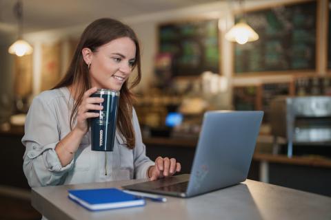 UNH student working on laptop