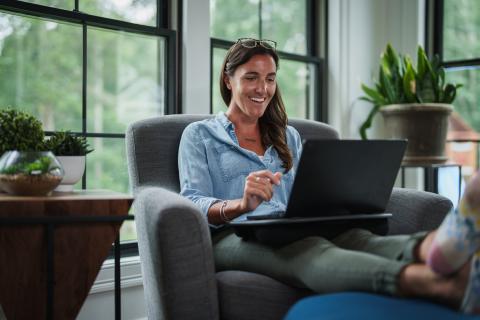 UNH student working on laptop