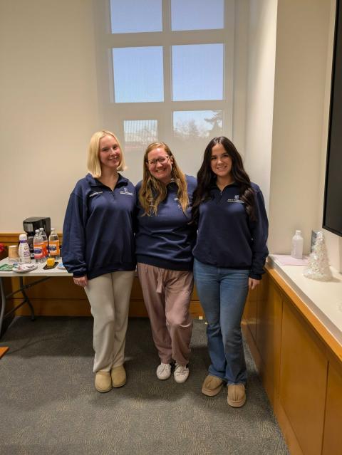 Sam at a Paul College Influencers meeting with her manager Shayna and coworker Kayla