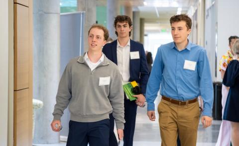 UNH students walking down hallway