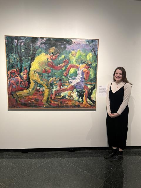 Molly with a painting that she wrote the object label for in UNH’s Gallery of Art