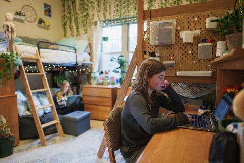 UNH students in residence hall room
